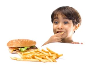 child eating junk food
