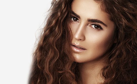 Beautiful-young-woman-with-long-curly-hairstyle-for-website