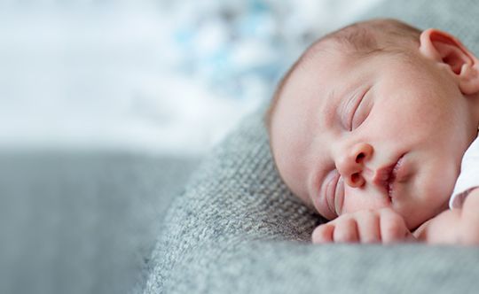 Featured-image-baby-boy-lying-on-bed-sleeping