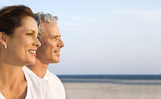 Featured-image- smiling-middle-aged-couple-on beach-for-website